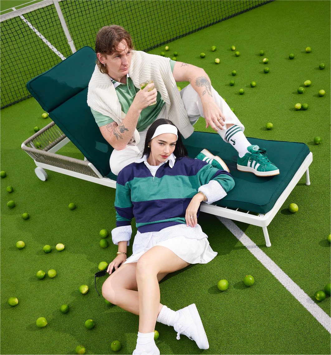 Two fashionable models dressed in tennis-core outfits