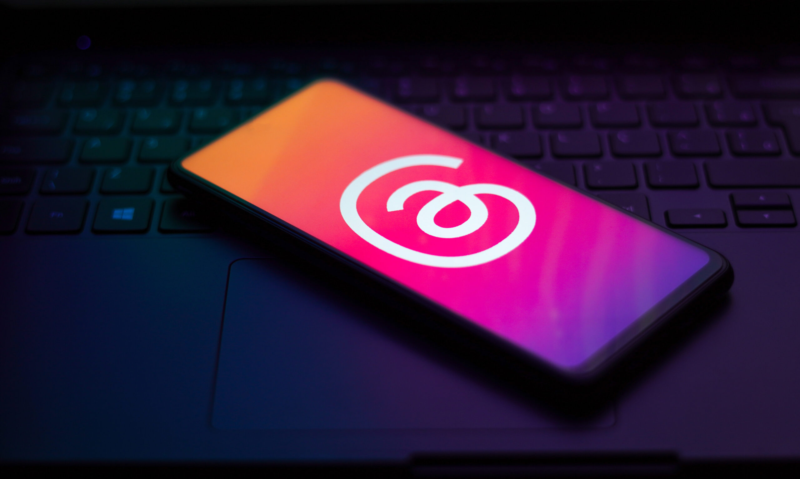 A phone with the Threads logo