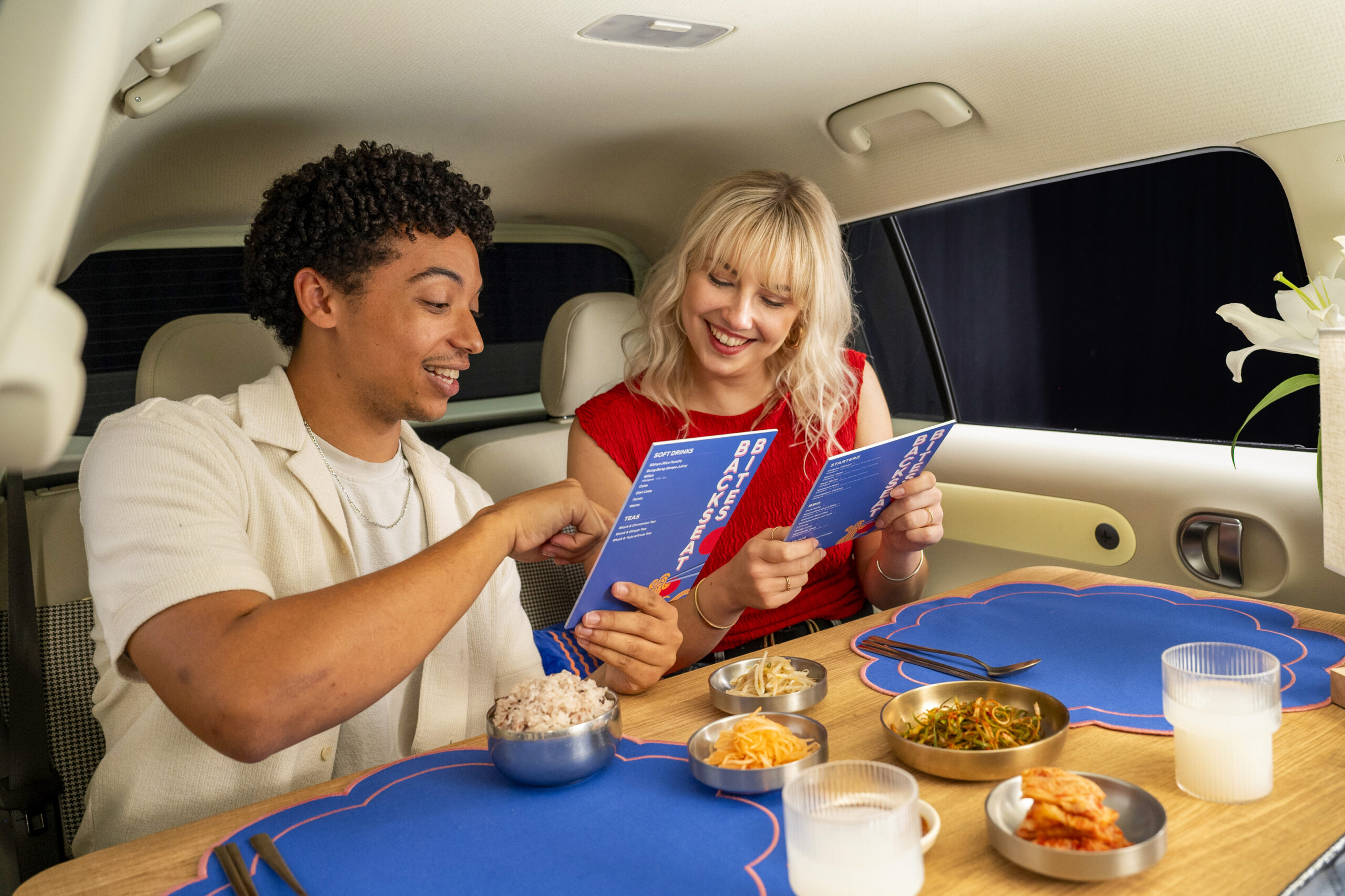 People dining in a car restaurant