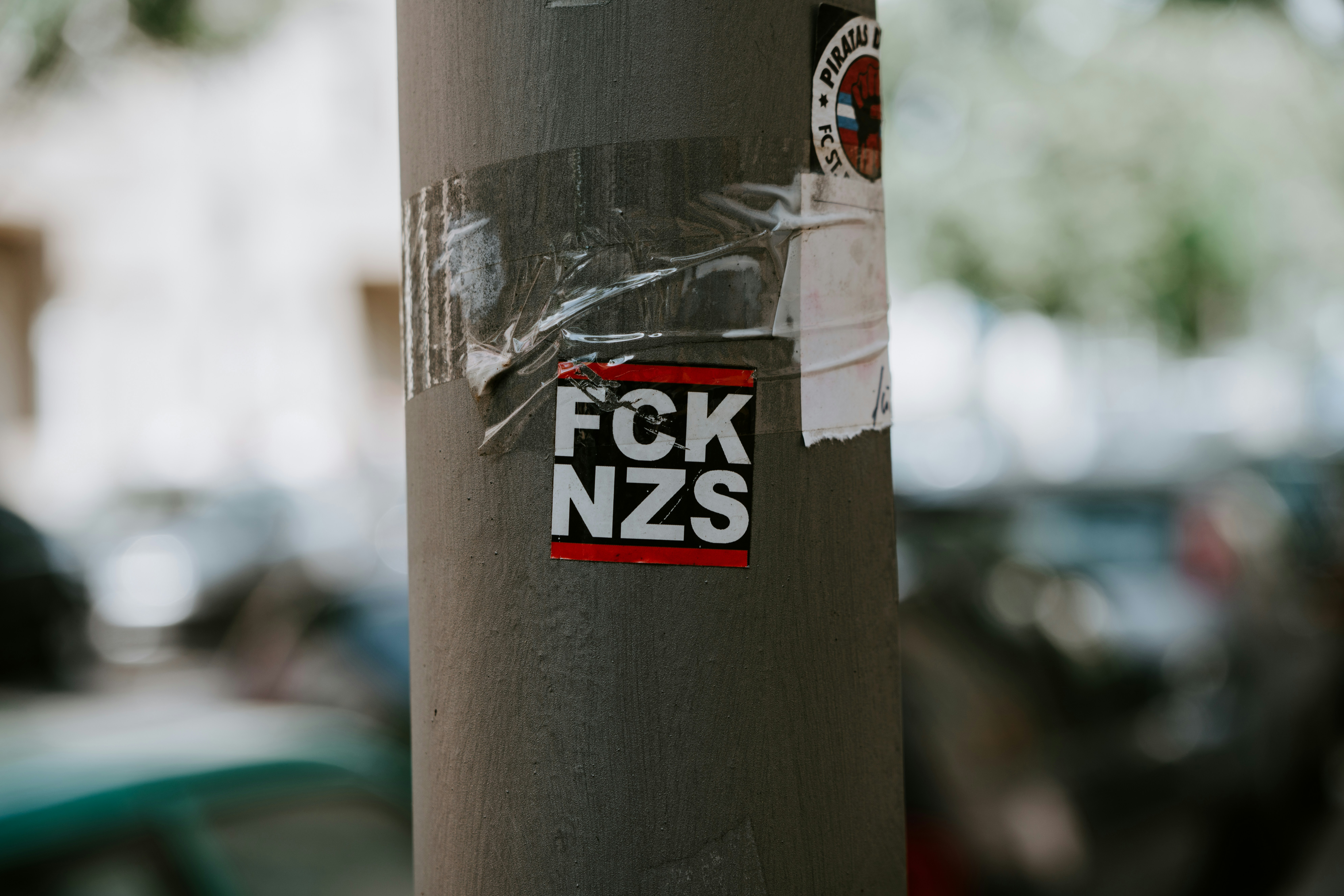 an anti-nazi slogan pasted to a telegraph pole